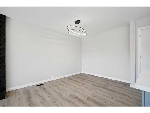 139 Bracewood Road Sw, Calgary, AB - Indoor Photo Showing Living Room With Fireplace