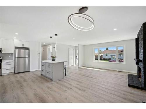 139 Bracewood Road Sw, Calgary, AB - Indoor Photo Showing Living Room With Fireplace