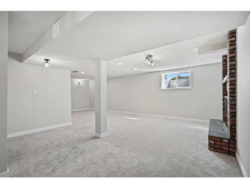 139 Bracewood Road Sw, Calgary, AB - Indoor With Fireplace