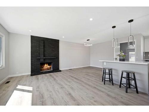 139 Bracewood Road Sw, Calgary, AB - Indoor With Fireplace