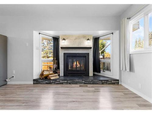 5517 50 Street, Olds, AB - Indoor Photo Showing Living Room With Fireplace