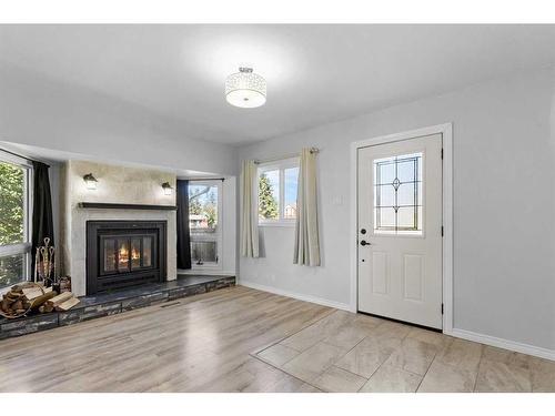 5517 50 Street, Olds, AB - Indoor Photo Showing Living Room With Fireplace