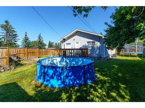 5517 50 Street, Olds, AB - Outdoor With Above Ground Pool With Backyard