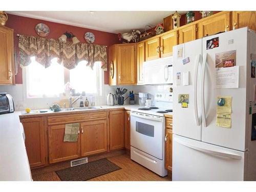 5628 Sunrise Crescent, Olds, AB - Indoor Photo Showing Kitchen With Double Sink