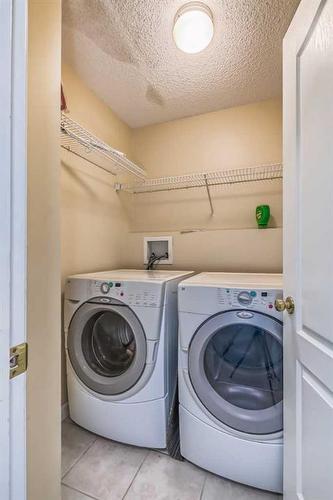 97 Douglas Ridge Circle Se, Calgary, AB - Indoor Photo Showing Laundry Room