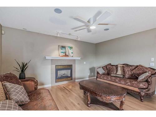 97 Douglas Ridge Circle Se, Calgary, AB - Indoor Photo Showing Living Room With Fireplace