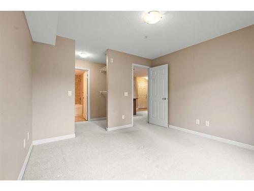 3203-92 Crystal Shores Road, Okotoks, AB - Indoor Photo Showing Other Room