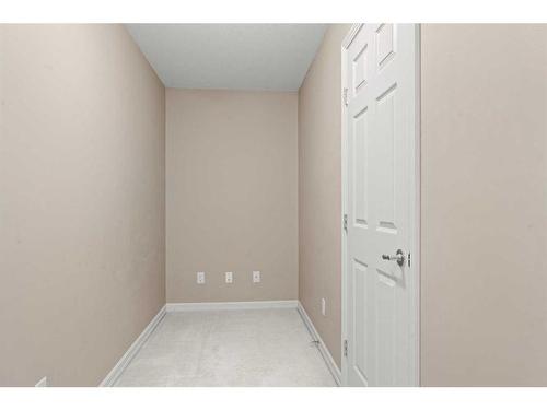 3203-92 Crystal Shores Road, Okotoks, AB - Indoor Photo Showing Other Room