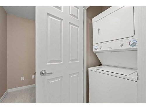 3203-92 Crystal Shores Road, Okotoks, AB - Indoor Photo Showing Laundry Room