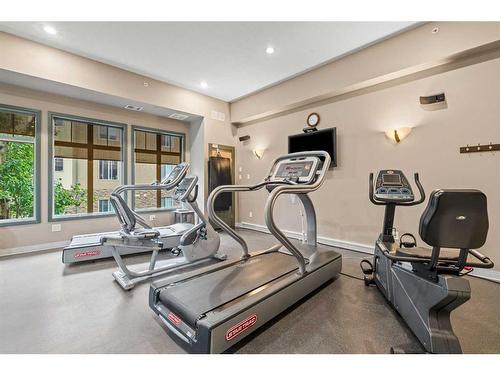 3203-92 Crystal Shores Road, Okotoks, AB - Indoor Photo Showing Gym Room