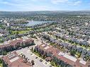 3203-92 Crystal Shores Road, Okotoks, AB  - Outdoor With Body Of Water With View 