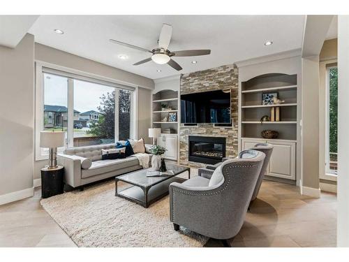 156 Rainbow Falls Glen, Chestermere, AB - Indoor Photo Showing Living Room With Fireplace