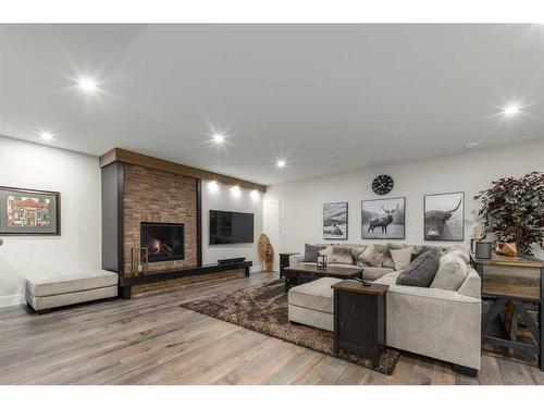 5303 Thornbriar Road Nw, Calgary, AB - Indoor Photo Showing Living Room With Fireplace