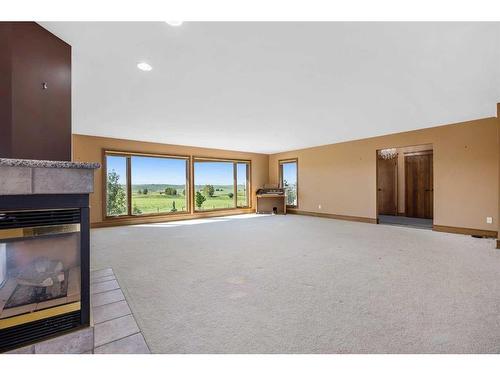 42053 Township Road 252, Rural Rocky View County, AB - Indoor Photo Showing Living Room With Fireplace