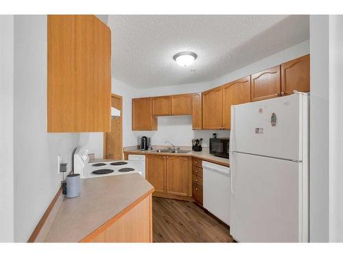 205-3 Somervale View Sw, Calgary, AB - Indoor Photo Showing Kitchen With Double Sink