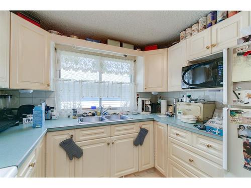 2412 43 Street Se, Calgary, AB - Indoor Photo Showing Kitchen With Double Sink