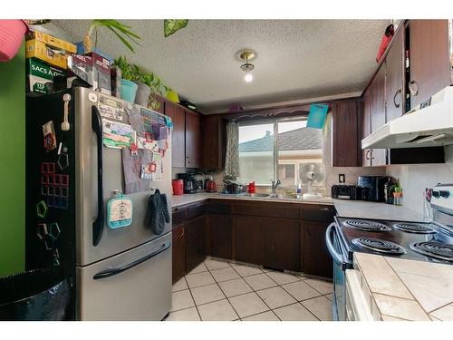 2412 43 Street Se, Calgary, AB - Indoor Photo Showing Kitchen With Double Sink