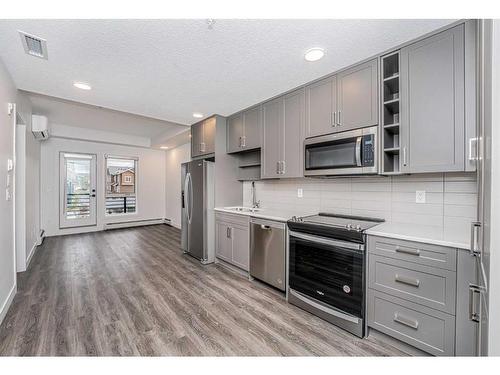 2305-350 Livingston Common Ne, Calgary, AB - Indoor Photo Showing Kitchen With Stainless Steel Kitchen With Upgraded Kitchen