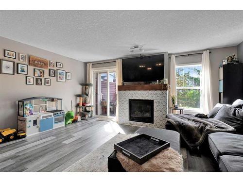 148 Chaparral Valley Gardens Se, Calgary, AB - Indoor Photo Showing Living Room With Fireplace