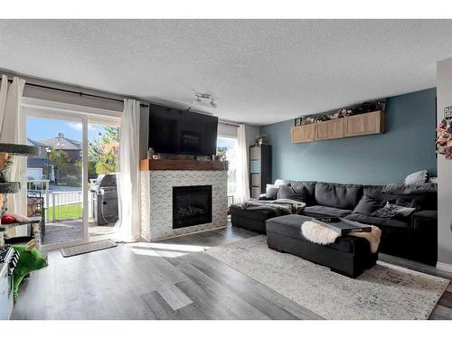 148 Chaparral Valley Gardens Se, Calgary, AB - Indoor Photo Showing Living Room With Fireplace