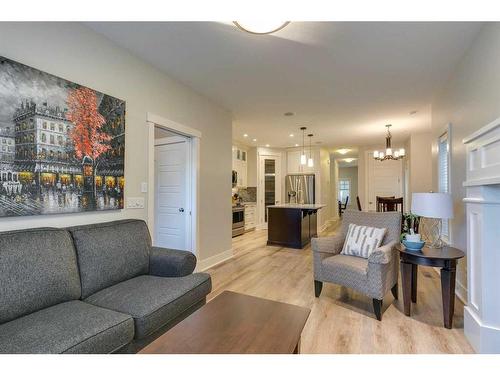 710 23 Avenue Nw, Calgary, AB - Indoor Photo Showing Living Room With Fireplace