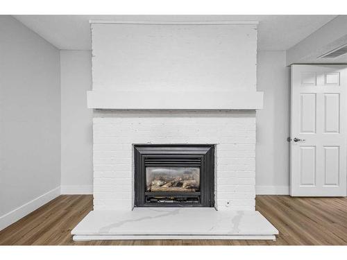 6112 4 Street Ne, Calgary, AB - Indoor Photo Showing Living Room With Fireplace