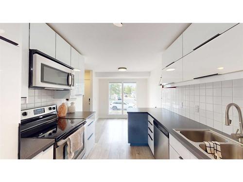 38 Sunhurst Crescent Se, Calgary, AB - Indoor Photo Showing Kitchen With Stainless Steel Kitchen With Double Sink