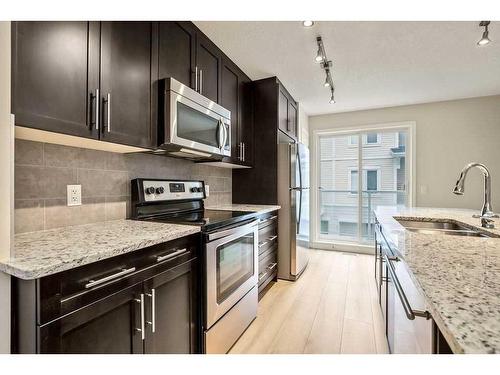 707 Auburn Bay Square Se, Calgary, AB - Indoor Photo Showing Kitchen With Stainless Steel Kitchen With Double Sink With Upgraded Kitchen