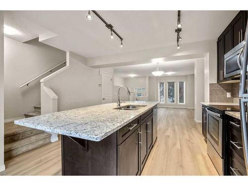 707 Auburn Bay Square Se, Calgary, AB - Indoor Photo Showing Kitchen With Double Sink With Upgraded Kitchen