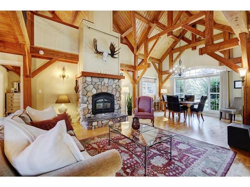 2407 Hwy 582, Didsbury, AB - Indoor Photo Showing Living Room With Fireplace