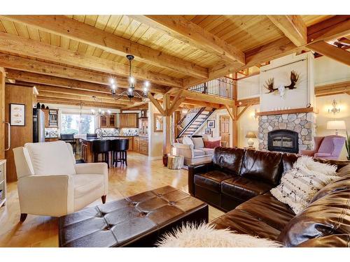 2407 Hwy 582, Didsbury, AB - Indoor Photo Showing Living Room With Fireplace