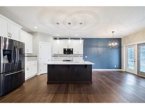 20 Stone Garden Crescent, Carstairs, AB - Indoor Photo Showing Kitchen With Double Sink