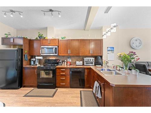 174 New Brighton Point Se, Calgary, AB - Indoor Photo Showing Kitchen With Double Sink