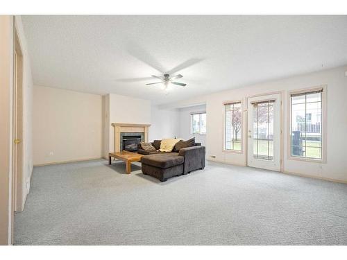 95-72 Millside Drive Sw, Calgary, AB - Indoor With Fireplace