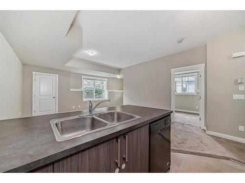 198-300 Marina Drive, Chestermere, AB - Indoor Photo Showing Kitchen With Double Sink