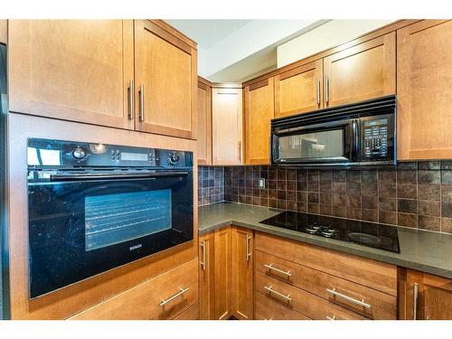 308-26 Val Gardena View Sw, Calgary, AB - Indoor Photo Showing Kitchen