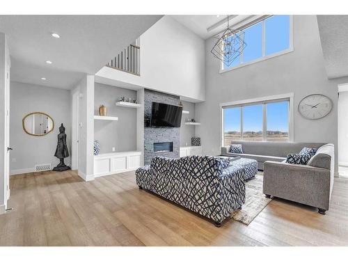 26 Chelsea Bay, Chestermere, AB - Indoor Photo Showing Living Room With Fireplace