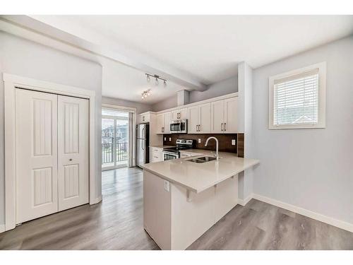 211-355 Nolancrest Heights Nw, Calgary, AB - Indoor Photo Showing Kitchen With Double Sink