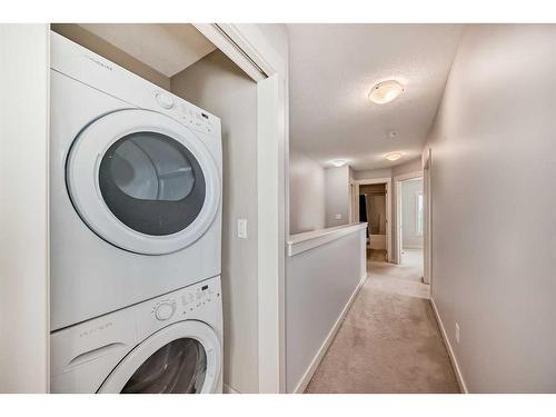 211-355 Nolancrest Heights Nw, Calgary, AB - Indoor Photo Showing Laundry Room