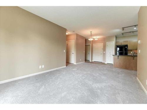 101-52 Cranfield Link Se, Calgary, AB - Indoor Photo Showing Kitchen With Double Sink