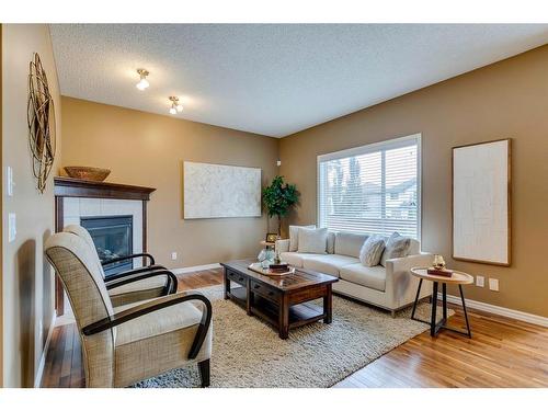 73 Cranwell Green Se, Calgary, AB - Indoor Photo Showing Living Room With Fireplace