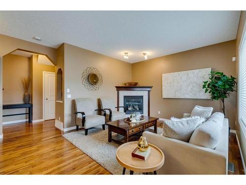 73 Cranwell Green Se, Calgary, AB - Indoor Photo Showing Living Room With Fireplace