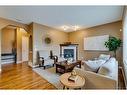 73 Cranwell Green Se, Calgary, AB  - Indoor Photo Showing Living Room With Fireplace 