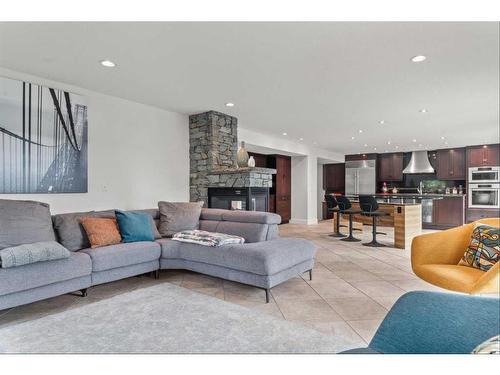 60 Deerbrook Crescent Se, Calgary, AB - Indoor Photo Showing Living Room With Fireplace