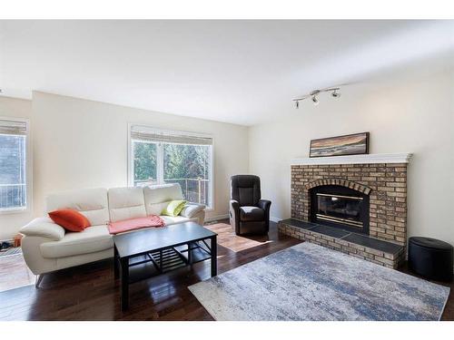 82 Douglasbank Way Se, Calgary, AB - Indoor Photo Showing Living Room With Fireplace