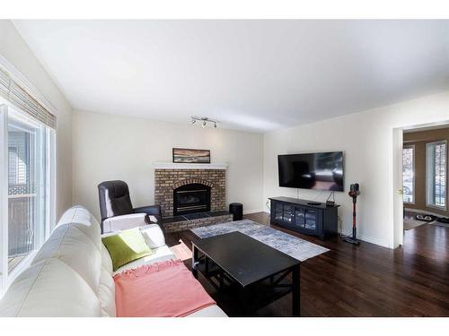 82 Douglasbank Way Se, Calgary, AB - Indoor Photo Showing Living Room With Fireplace