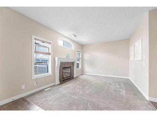 133 Saddleland Close Ne, Calgary, AB - Indoor With Fireplace