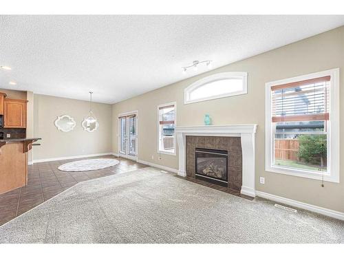 133 Saddleland Close Ne, Calgary, AB - Indoor Photo Showing Living Room With Fireplace