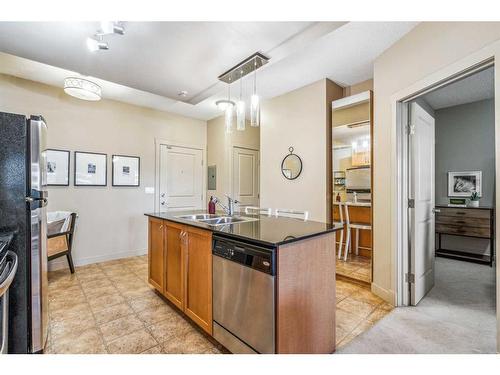 1308-11811 Lake Fraser Drive Se, Calgary, AB - Indoor Photo Showing Kitchen With Double Sink