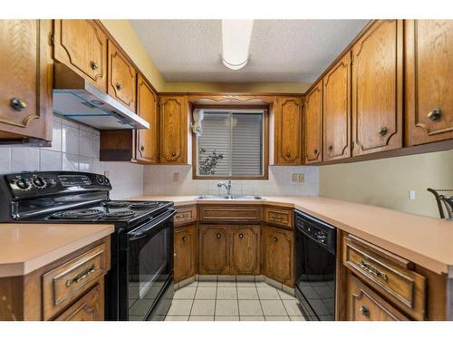 67 Tararidge Place Ne, Calgary, AB - Indoor Photo Showing Kitchen With Double Sink